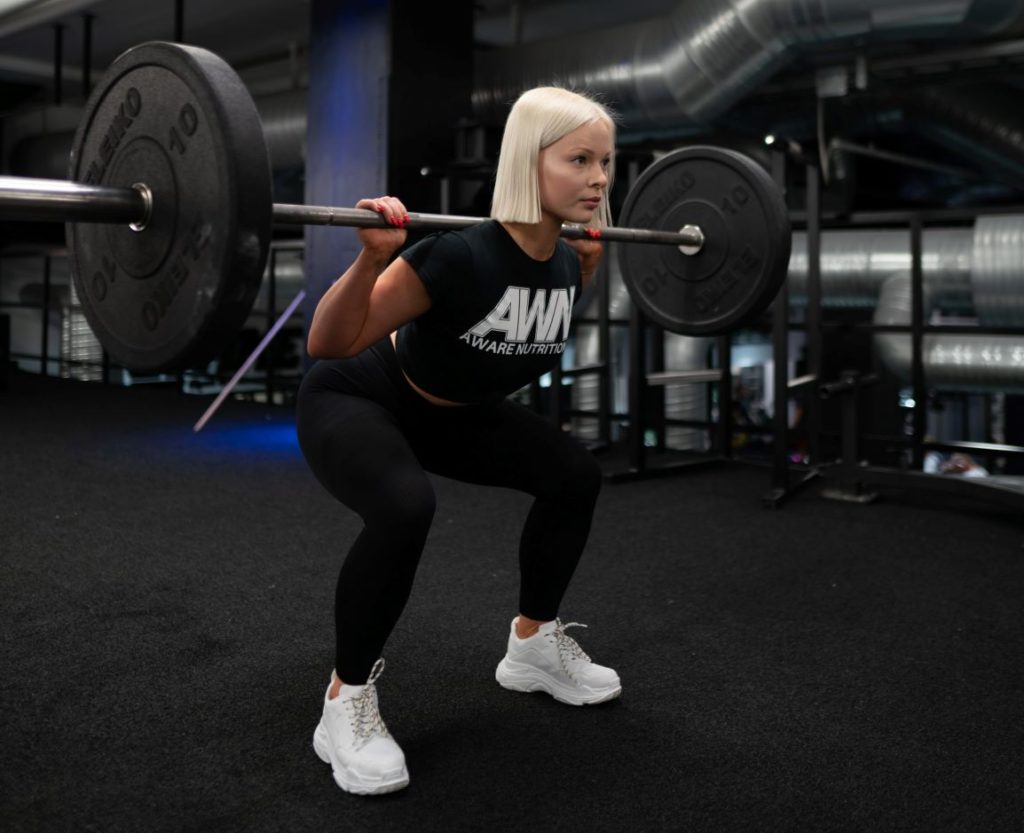 fit woman doing squats
